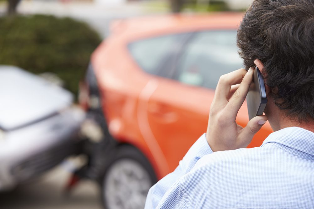 Photo of a Person Calling after Accident