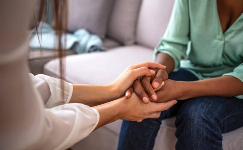 Photo of a people holding hands