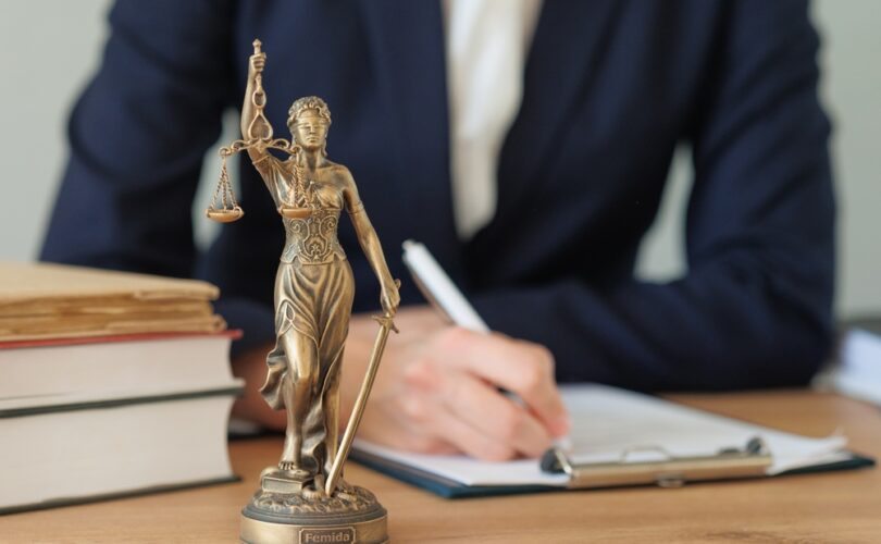 Photo of lady justice statue on the table