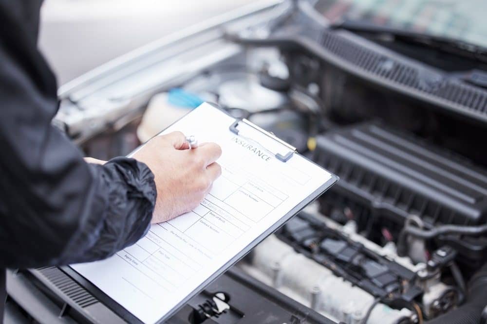 Photo of a man looking at the car