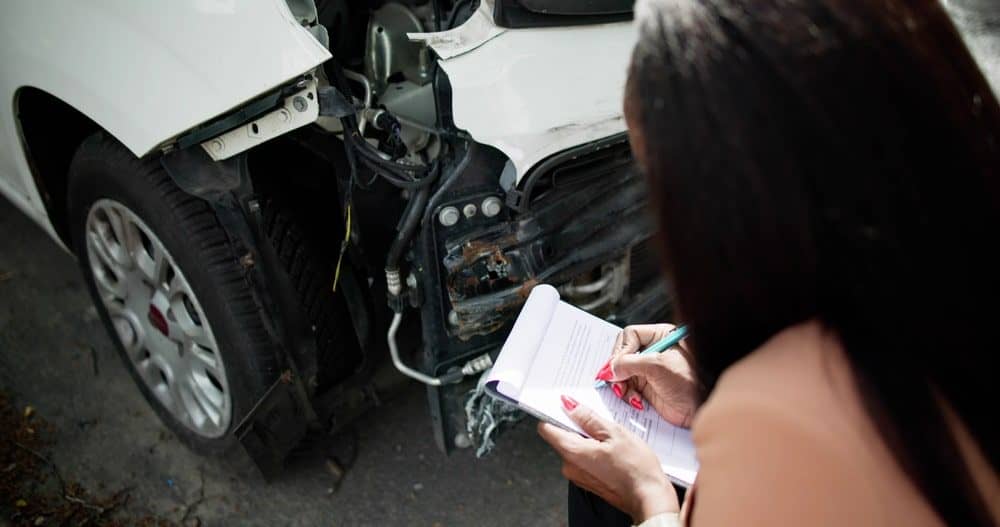 Photo of a Woman taking Notes