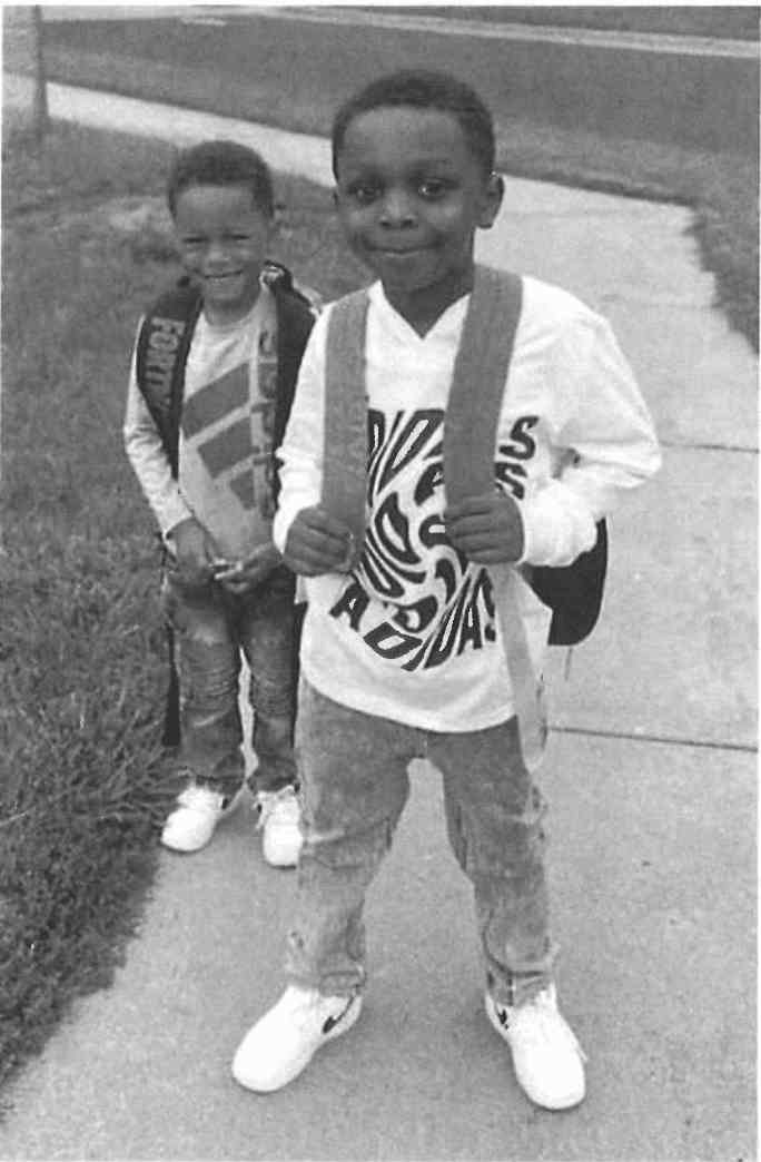 A pair of young boys smiling