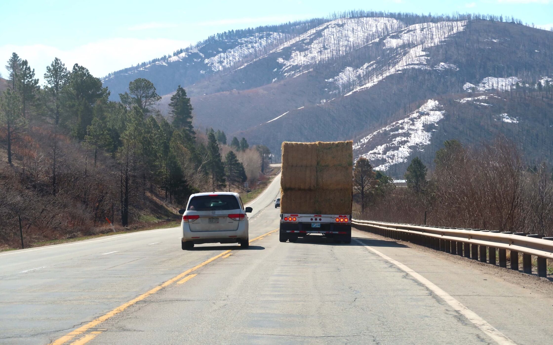 Small car passing a semi truck