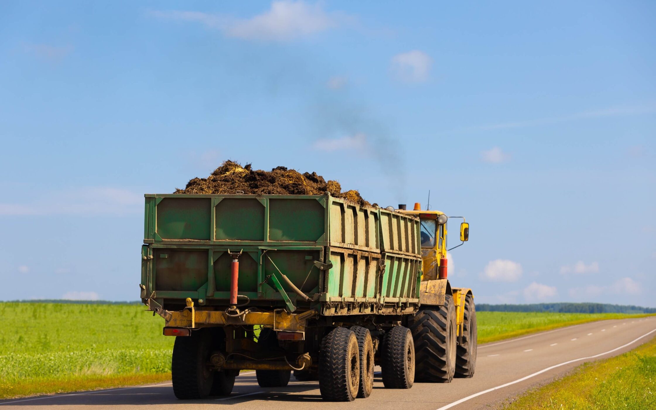 Agricultural truck overloaded with organic manure